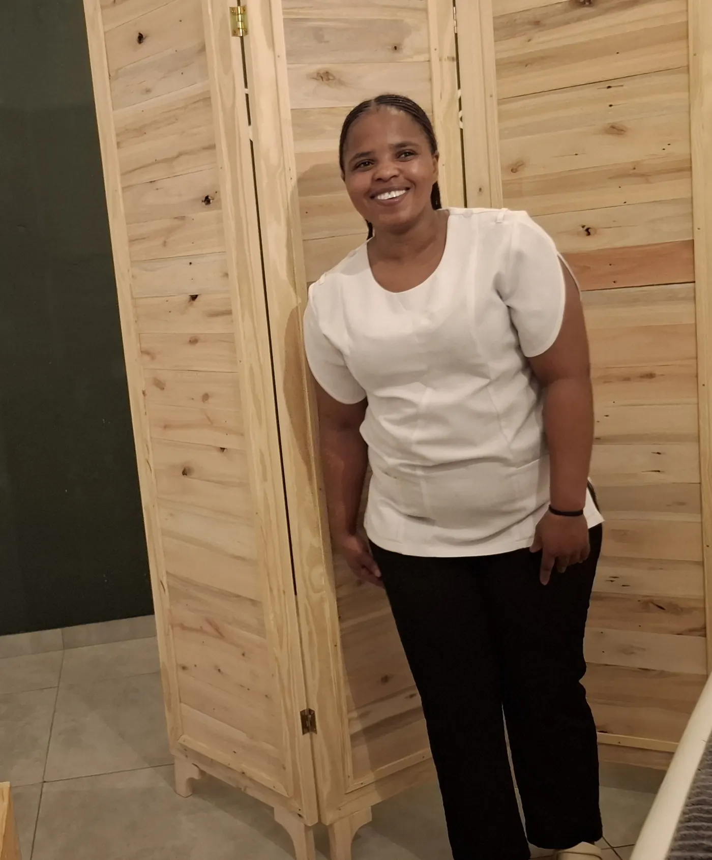Amahle, a Restored therapist, smiling in the studio