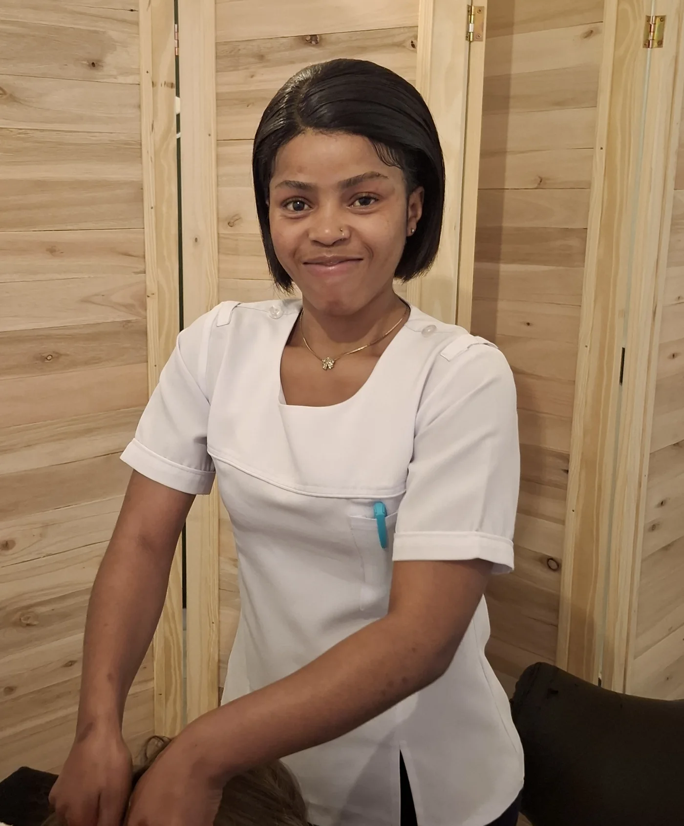 Isabelle, a Restored therapist, smiling in the studio